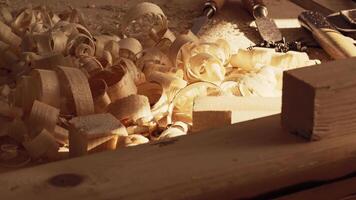 Crafting with wood shavings in a workshop illuminated by natural light video