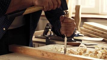 Crafting wood with precision tools in a workshop environment during daytime hours video