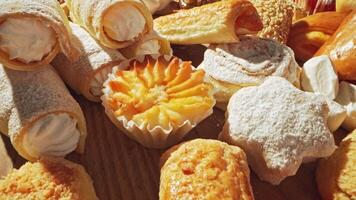 Delightful display of assorted pastries at a vibrant bakery in the morning light video