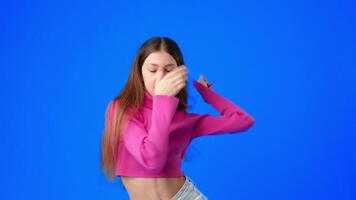 Dancer performs stylish routine against vibrant blue background showcasing creativity and skill video