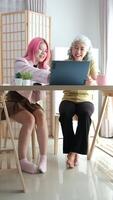 Digital Literacy and Intergenerational Learning. A daughter patiently teaches her elderly mother how to use a laptop, bridging the technology gap at home. video
