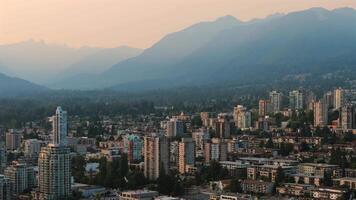 Aerial view of the skyscrapers in Downtown of Vancouver and mountains around video