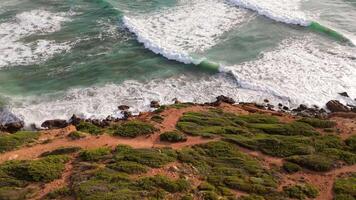 Aerial view seashore cliffs wave crashing on rocks. Sardinia, Italy. video
