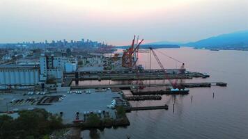 Aerial view of Port of Vancouver, harbour and mountains on the background video