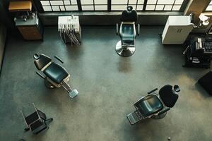 Modern Barber Shop Interior With Three Chairs And Equipment photo