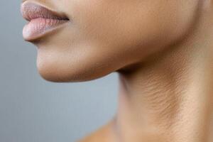 A close up of a woman's neck and face photo
