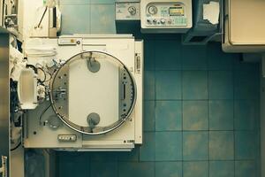 A hospital room with a bed and a toilet photo