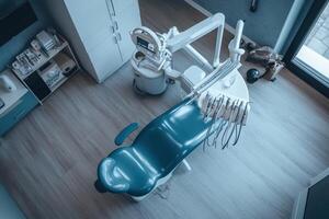 A dental chair is shown in a room with a window photo
