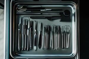 A tray with a variety of tools in it photo