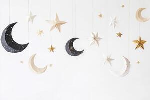 Celestial Paper Crafts Hang Against White Background photo