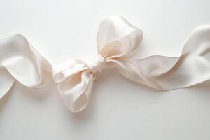 Elegant Cream Satin Ribbon Bow on White Background photo