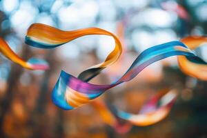 Colorful ribbons swirl in autumnal bokeh background photo