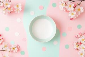 Pastel Bowl Surrounded by Spring Blossoms and Confetti photo