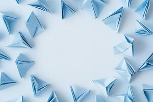 Blue Paper Boats Arranged in a Circular Frame photo