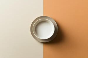 Empty Bowl and Plate on Two Tone Background photo