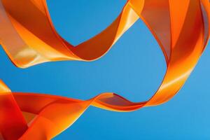 Orange Fabric Ribbon Waves Against Blue Sky photo