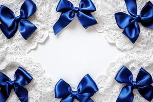 Blue satin bows arranged on white lace background photo