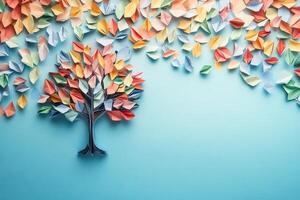Origami Tree with Colorful Paper Leaves on Blue Background photo