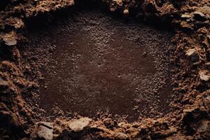 Dark Brown Substance Surrounded By Coarse Granules photo