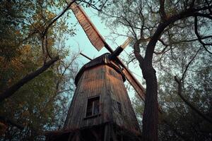 An old windmill in the woods photo