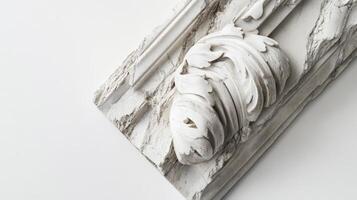 A white marble sculpture with a flower on it photo