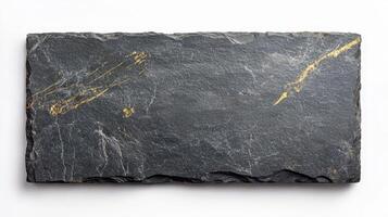 A black slate board with gold paint on it photo