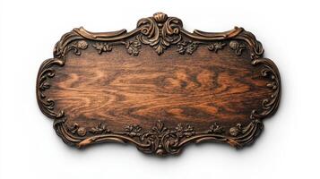 Wooden plaque with ornate design on white background photo