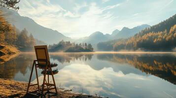 An easel and a painting stand in front of a lake photo
