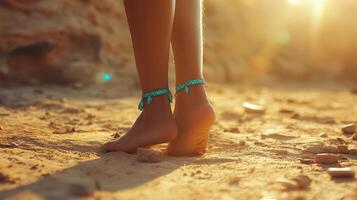 A woman's bare feet on the sand photo