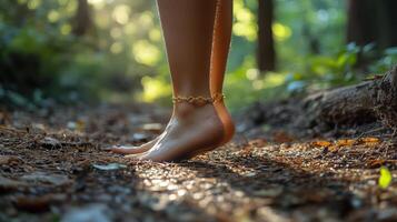 A woman's bare feet in the woods photo