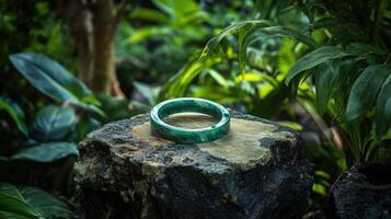 A ring sitting on top of a rock in the jungle photo