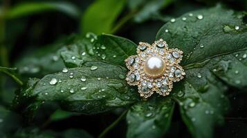 A brooch with a pearl sits on a leaf photo