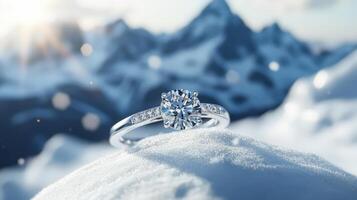 A diamond engagement ring sitting on top of a mountain photo