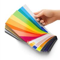 Hand holding a stack of color swatches photo