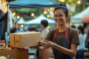 Happy vendor at a night market handles a food order photo