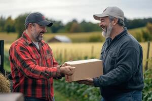 Farmers exchanging a package outdoors on a farm photo