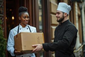 Chefs exchanging a box outside a restaurant photo