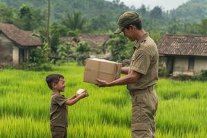 Delivery Man Giving Package to a Boy in Rice Paddy Field photo
