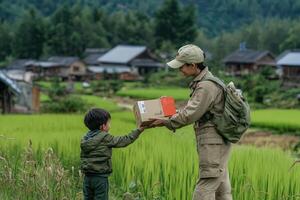 Delivery woman gives package to child in rural setting photo