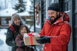 Man gives Christmas gift to happy family in snowy weather photo