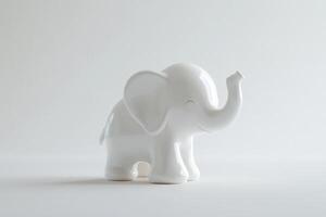 A white ceramic baby elephant figurine stands on a white background photo