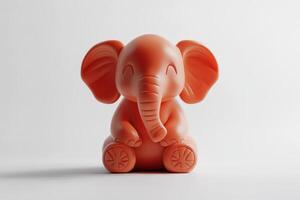 A Cute Orange Elephant Figurine Sitting Down photo