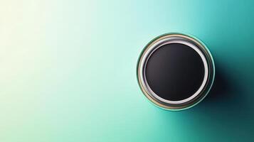 A black circular object on a green background photo
