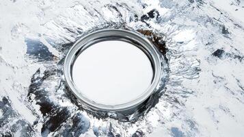 White paint in a metallic container surrounded by textured swirls photo