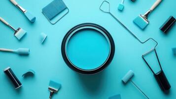 Paint brushes and paint cans on a blue background photo