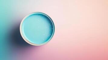 A Teal Paint Can With Glittering Specks photo