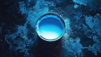Blue Paint in a Tin on a Dark Surface photo