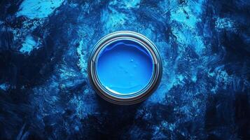 A Can Of Vibrant Blue Paint On A Blue Background photo