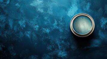 Metallic Paint Can on Textured Blue Background photo
