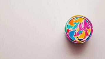 Colorful Abstract Paint Design on a Round Container photo